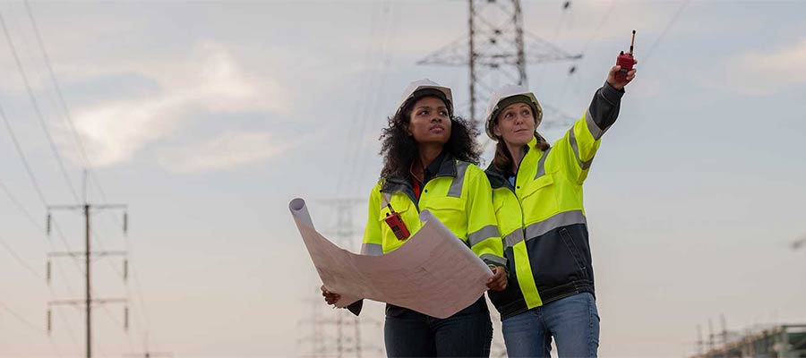 Engineers Wearing Safety Gear Including Hard Hats 2025 03 16 20 11 09 Utc 1600x650 400 Engineers wearing safety gear looking at power lines